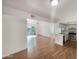 Open concept living room and kitchen with wood floors and access to balcony at 4730 W Northern Ave # 3067, Glendale, AZ 85301
