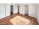 Well-lit bedroom with wood flooring and closets at 4730 W Northern Ave # 3067, Glendale, AZ 85301