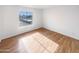 Bedroom with wood floors and a window providing natural light at 4730 W Northern Ave # 3067, Glendale, AZ 85301