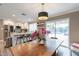 Kitchen features island with seating and modern appliances, plus a view to the pool at 8608 E Angus Dr, Scottsdale, AZ 85251