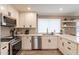Modern kitchen with white shaker cabinets, quartz countertops, and stainless steel appliances at 8608 E Angus Dr, Scottsdale, AZ 85251