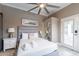 Bright bedroom with queen bed and private access to patio at 8608 E Angus Dr, Scottsdale, AZ 85251