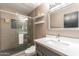 Updated bathroom with a walk-in shower and modern vanity at 8608 E Angus Dr, Scottsdale, AZ 85251