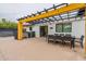 Backyard patio with pergola, outdoor kitchen, and hot tub at 8608 E Angus Dr, Scottsdale, AZ 85251