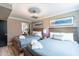Main bedroom with two double beds and wood-look flooring at 8608 E Angus Dr, Scottsdale, AZ 85251
