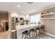 Modern kitchen with white shaker cabinets, quartz countertops, and stainless steel appliances at 8608 E Angus Dr, Scottsdale, AZ 85251