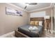 Cozy bedroom with a full-size bed, wood headboard, and neutral decor at 8608 E Angus Dr, Scottsdale, AZ 85251