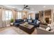 Open living area featuring a sectional sofa and stylish coffee table at 8608 E Angus Dr, Scottsdale, AZ 85251