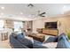 Spacious living room with sectional sofa, large TV, and wood media console at 8608 E Angus Dr, Scottsdale, AZ 85251