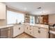 Modern kitchen with white shaker cabinets, quartz countertops, and stainless steel appliances at 8608 E Angus Dr, Scottsdale, AZ 85251