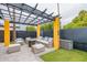 Relaxing patio with covered seating area and fire pit at 8608 E Angus Dr, Scottsdale, AZ 85251