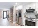 Modern kitchen with white shaker cabinets, quartz countertops and stainless steel appliances at 8608 E Angus Dr, Scottsdale, AZ 85251
