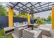 Outdoor patio with pergola, seating, and pool view at 8608 E Angus Dr, Scottsdale, AZ 85251