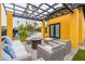 Backyard patio with pergola, seating, and house view at 8608 E Angus Dr, Scottsdale, AZ 85251