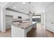 Modern kitchen featuring granite countertops and stainless steel appliances at 21451 W Palm Ln, Buckeye, AZ 85396
