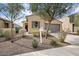 House exterior showcasing landscaping and driveway at 21451 W Palm Ln, Buckeye, AZ 85396