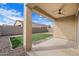 Covered patio and artificial turf backyard at 21451 W Palm Ln, Buckeye, AZ 85396