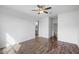 Large bedroom with hardwood floors and access to bathroom at 21451 W Palm Ln, Buckeye, AZ 85396