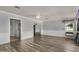 Bright living room featuring wood-look floors and ceiling fan at 9225 N 107Th Ave, Sun City, AZ 85351