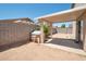 Covered patio and spacious backyard with dog house at 2343 E Meadow Land Dr, San Tan Valley, AZ 85140