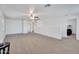 Spacious bonus room with neutral carpeting and ceiling fan at 2343 E Meadow Land Dr, San Tan Valley, AZ 85140