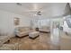 Living room with beige sofas, tiled floors, and a ceiling fan at 2343 E Meadow Land Dr, San Tan Valley, AZ 85140