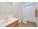 Clean bathroom with a shower/tub combo and wood vanity at 2343 E Meadow Land Dr, San Tan Valley, AZ 85140