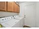 Laundry room with washer, dryer, and cabinets at 2343 E Meadow Land Dr, San Tan Valley, AZ 85140