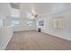 Spacious loft area with neutral carpet and ceiling fan at 2343 E Meadow Land Dr, San Tan Valley, AZ 85140