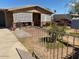 Charming ranch home with a brick facade, and a spacious front yard with landscaping at 303 N 7Th St, Avondale, AZ 85323