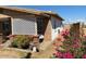 Home exterior showcasing brick detailing and a covered patio area at 303 N 7Th St, Avondale, AZ 85323