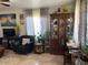 Living room with ample natural light and a decorative china cabinet at 303 N 7Th St, Avondale, AZ 85323