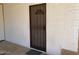 Side entrance with security door and brick exterior at 303 N 7Th St, Avondale, AZ 85323