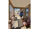 Covered porch with lattice accents and seating area at 303 N 7Th St, Avondale, AZ 85323