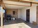 Covered carport area with exterior access door at 303 N 7Th St, Avondale, AZ 85323