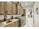 Laundry room with granite countertop, sink, and ample cabinet space at 26808 N 150Th St, Scottsdale, AZ 85262