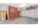 Spacious two-car garage with built-in storage cabinets at 20980 N Sweet Dreams Dr, Maricopa, AZ 85138