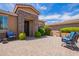 Inviting front entrance with stone accents and landscaping at 20980 N Sweet Dreams Dr, Maricopa, AZ 85138
