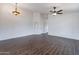 Spacious dining room with dark tile floors and ceiling fan at 16108 W Kendall St, Goodyear, AZ 85338