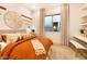Serene bedroom with warm color scheme and built-in shelving at 22511 E Saddle Ct, Queen Creek, AZ 85142