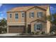Tan two-story house with brown garage door and gray shutters at 1720 W Coolidge Way, Coolidge, AZ 85128