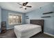 Bedroom with rustic style bed and floating shelves at 17218 N Melissa Ln, Surprise, AZ 85374