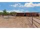 Spacious horse stables with multiple stalls and fenced-in areas at 35140 N 52Nd Pl, Cave Creek, AZ 85331