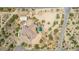 Aerial view of a large estate with a pool, stables and desert landscape at 35140 N 52Nd Pl, Cave Creek, AZ 85331