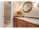 Bathroom with granite vanity and a large mirror at 35140 N 52Nd Pl, Cave Creek, AZ 85331