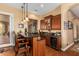 Wet bar with granite countertop and wood cabinetry at 35140 N 52Nd Pl, Cave Creek, AZ 85331