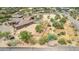 Aerial view of a house with a pool and large lot, ideal for horses at 35140 N 52Nd Pl, Cave Creek, AZ 85331