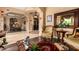 Spacious living room with comfortable seating, large windows, and a view to the dining area at 35140 N 52Nd Pl, Cave Creek, AZ 85331