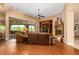 Relaxing living room with a fireplace, built-in shelving, hardwood floors, and sliding glass doors leading to a patio at 35140 N 52Nd Pl, Cave Creek, AZ 85331