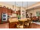 Island kitchen with granite countertops and dark wood cabinetry at 35140 N 52Nd Pl, Cave Creek, AZ 85331